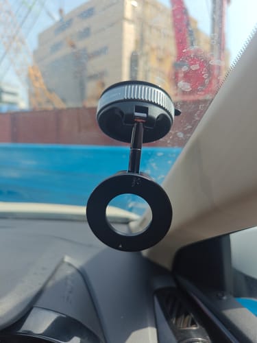 Customer's black MagPro Magnetic Phone Holder by Casence attached to the inside of a car windshield.