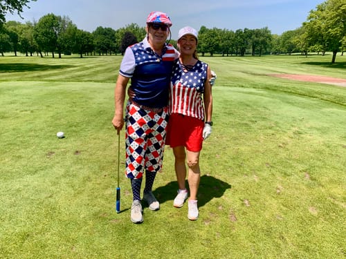 Customer wearing the Argyle US Star flag-Men's Golf Knickers Pants while standing on a golf course with a partner.