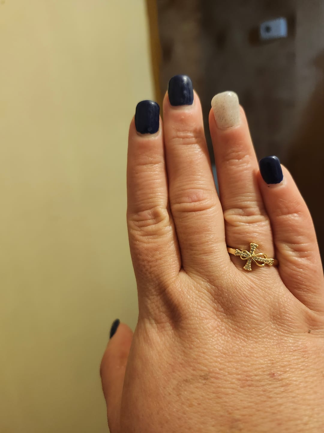 Customer photo review of Christianartworkshop Golden/Silver Mobius Cross Ring: Carry His Grace in Daily Wear