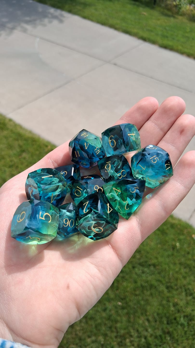 Customer photo review of URWizards D&D Resin Tidebound Fate Engraved Dice Set Multi-faceted Style