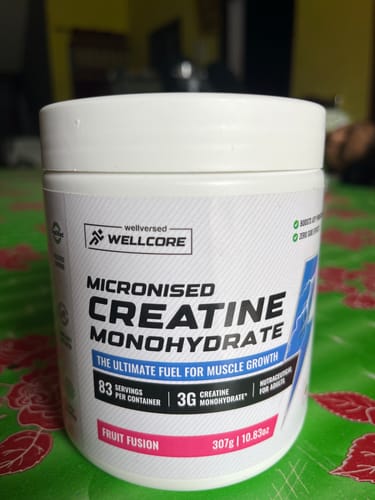 Customer's white tub of Wellcore Micronised Creatine Monohydrate, Fruit Fusion flavor.