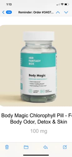 Customer's clear bottle of Body Magic Chlorophyll Pills, showing the dark green capsules inside.