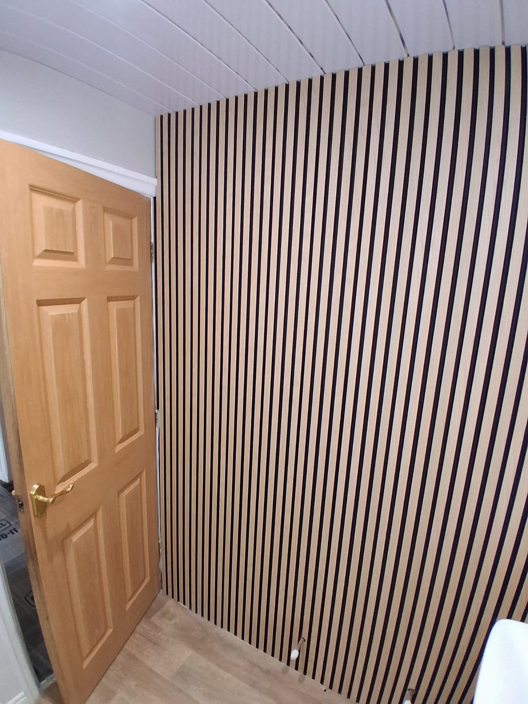 Customer photo review of SlatWall Waterproof Natural Oak and Black Panel