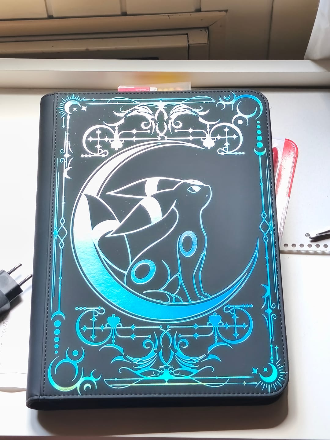 Customer photo review of Lunar Shadow Shiny 9-Pocket Trading Card Binder