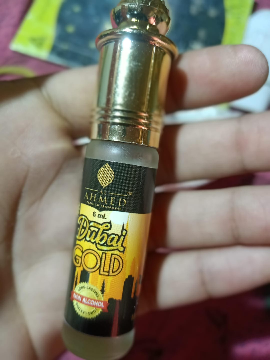 Customer photo review of Al Ahmed Dubai Gold Attar Roll on Perfume | Long lasting Fragrance Perfume For Men and Women | 100% Alcohol Free Attar Perfume | 6ml)