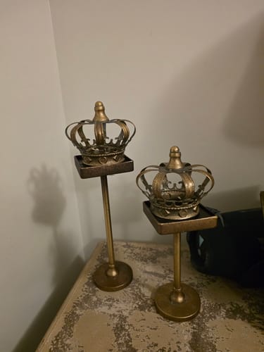 Reviewer's Jade Crown Tealight Holder Set in antique gold finish, placed on a bedside table.