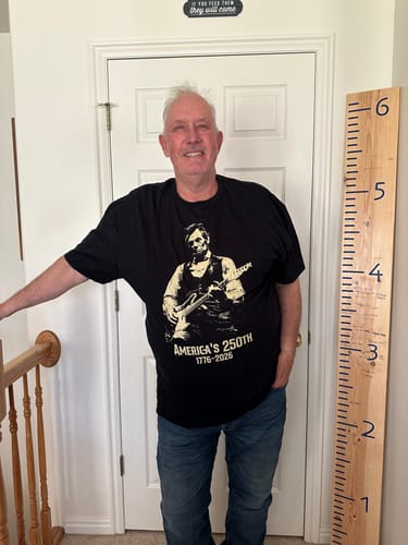 Customer wearing the black graphic Lincoln 250 T-Shirt, showing how it fits.