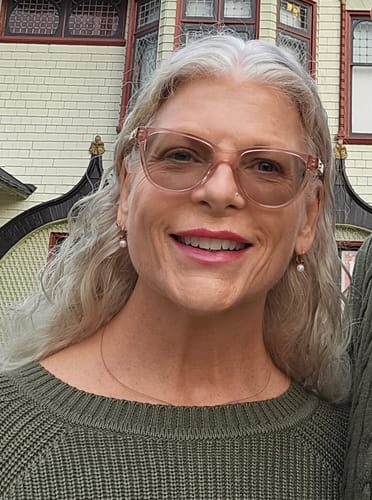 Reviewer smiling, showing skin results after using the Seranova Micro Infusion System.