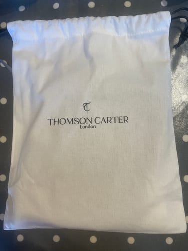 Customer's white drawstring carry bag that came with the Fragrance Discovery Kit.