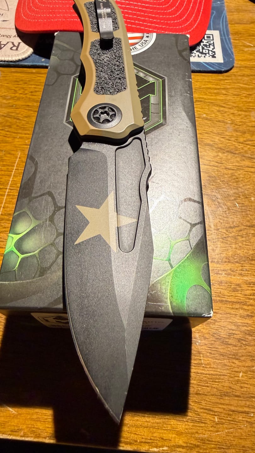 Customer photo review of Heretic Knives Wraith V4 SE Auto Knife – 3.7” MagnaCut Blade, Blizzard Chassis, Battleworn Black – Made in USA