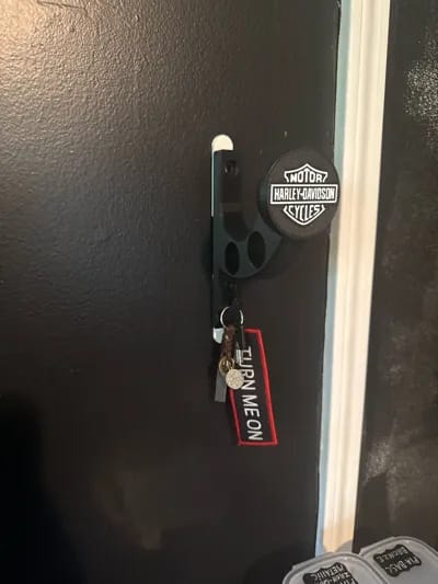 Customer photo review of Premium Wall Mount Helmet Holder - Heavy Duty Gear Organizer Stand with Dual Jacket Loops & Utility Key Hook (Matte Black & Red)