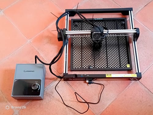 Customer's AtomStack Laser Engraving Area Extension Kit, fully assembled and connected to its control box on a tile floor.