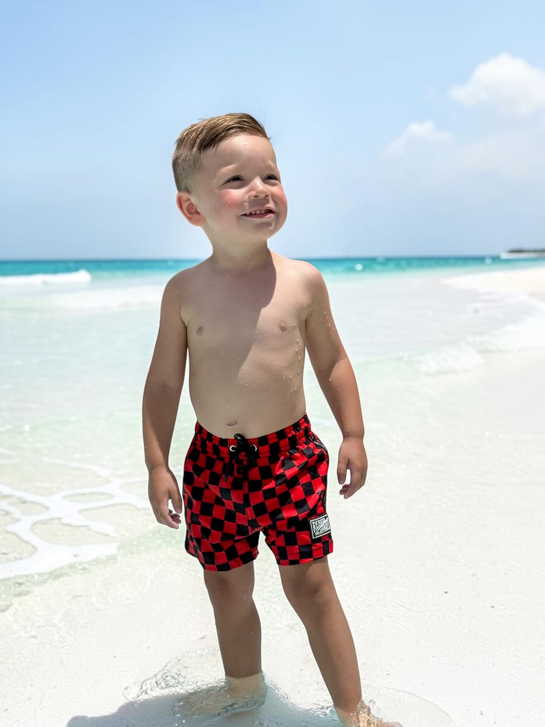 Customer photo review of Hybrid Swim Trunks in Americana Red + Black Checkered