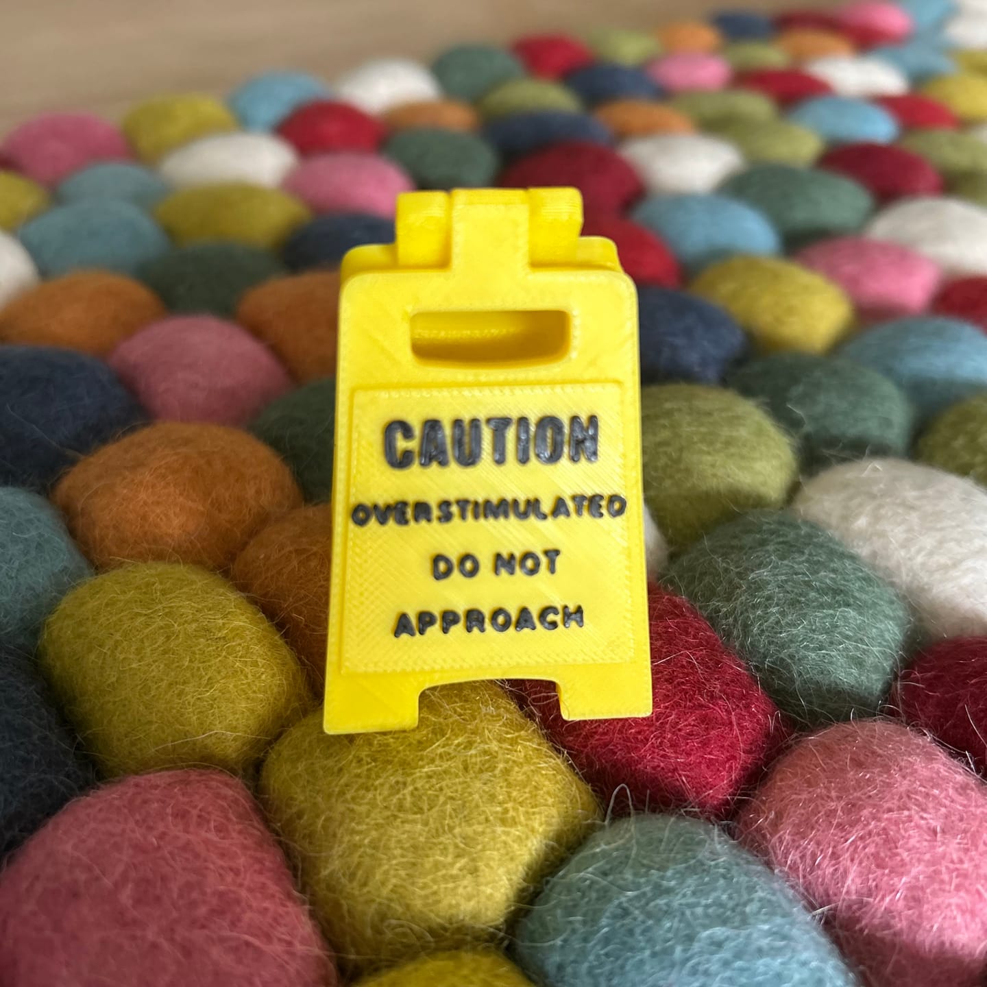 Customer photo review of Caution Overstimulated Do Not Approach Sign (Yellow)