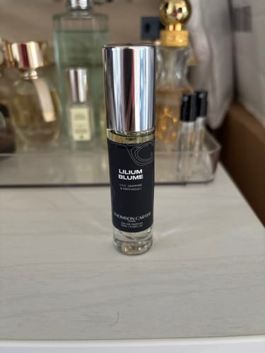Customer's Lilium Blume Eau de Parfum bottle with a silver cap, standing on a light-colored vanity.