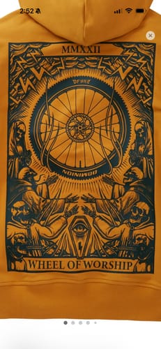 Customer's close-up of the detailed 'Wheel of Worship' graphic on the back of the yellow Tarot Trailhood.