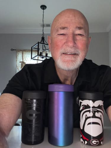 Customer with three Universal Buddy can coolers: a black design, an iridescent one, and a Georgia Bulldogs mascot.