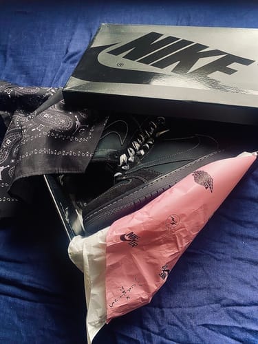 Customer photo review of Travis Scott x Air Jordan 1 Retro Low Black Phantom