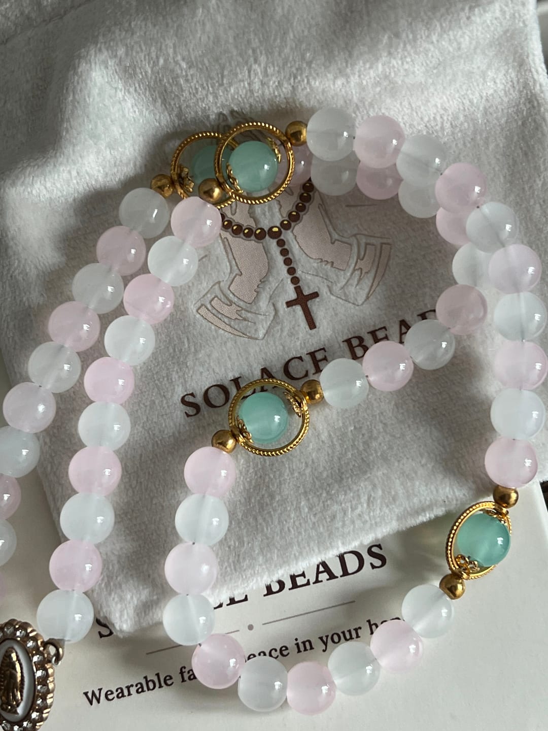 Customer photo review of SolaceBeads Artistic Pink & White Beaded Rosary: A Fusion of Colors & Sacred Symbols