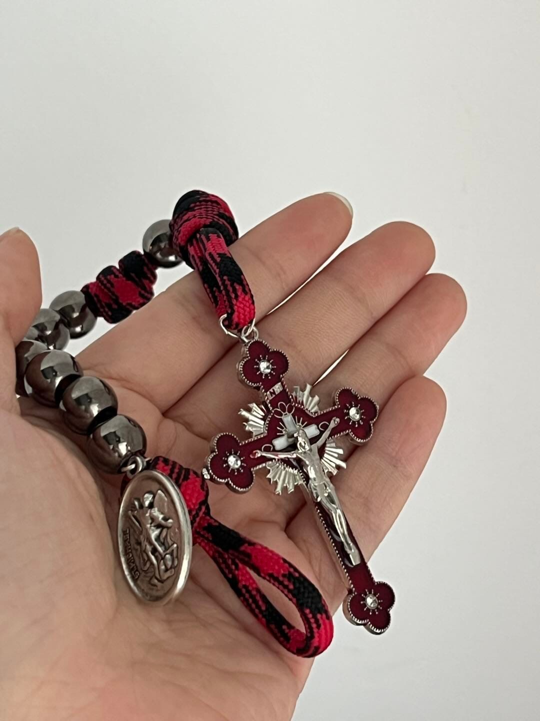 Customer photo review of Solacebeads Gunmetal Bead Car Rosary & Red Enamel Crucifix: Rooted In St. Michael Protection