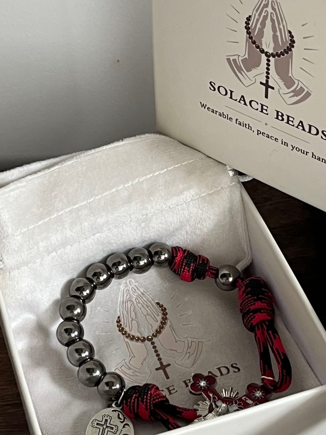 Customer photo review of Solacebeads Gunmetal Bead Car Rosary & Red Enamel Crucifix: Rooted In St. Michael Protection