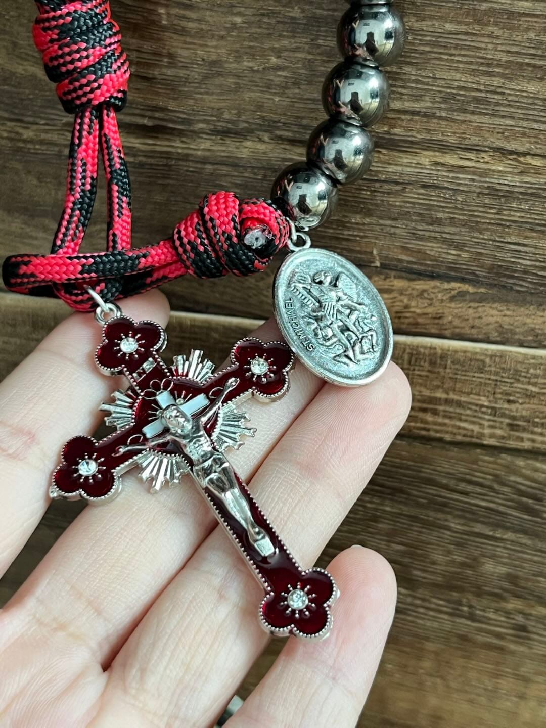 Customer photo review of Solacebeads Gunmetal Bead Car Rosary & Red Enamel Crucifix: Rooted In St. Michael Protection