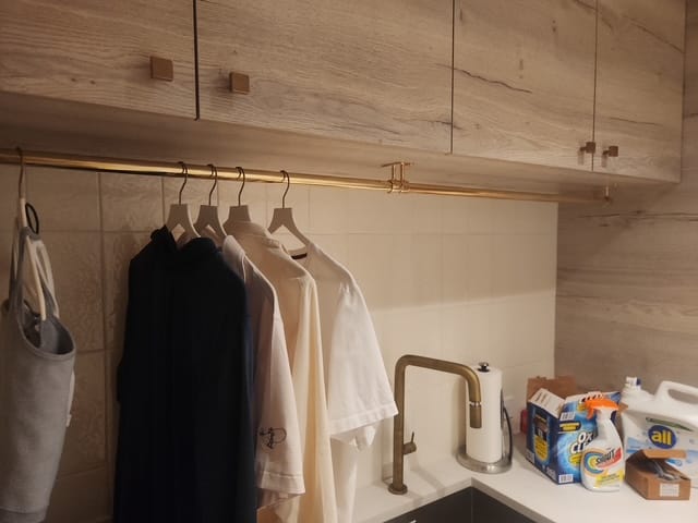 Customer photo review of Closet Rod – Unlacquered Polished Brass