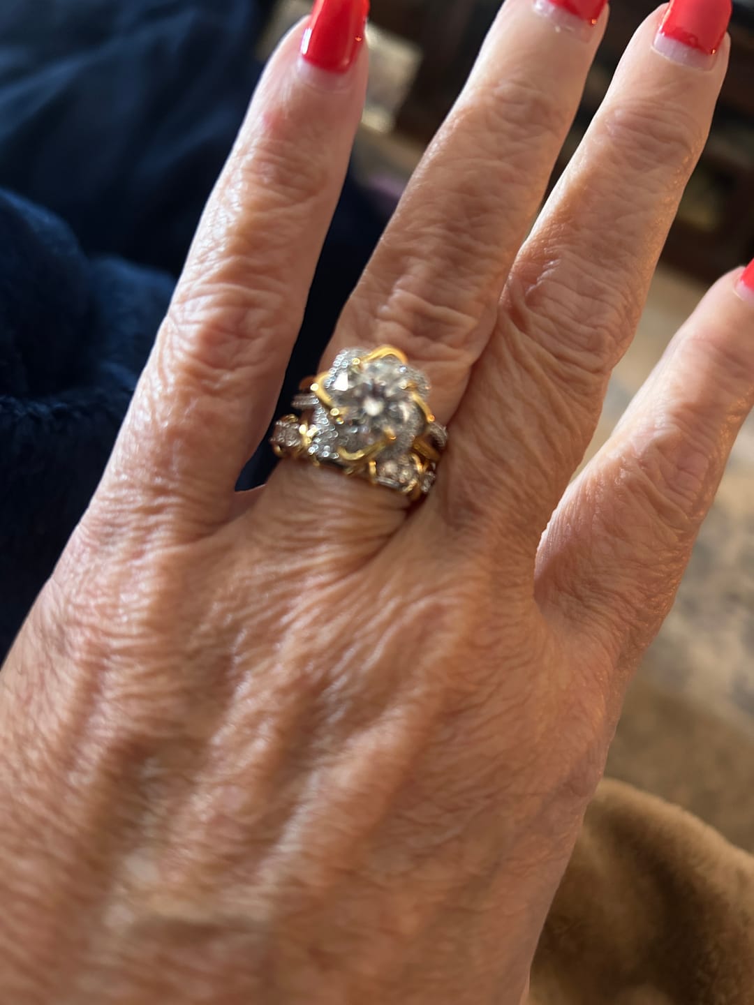 Customer photo review of Two-Tone Eternal Love Knot Round Moissanite Twisted Engagement Ring