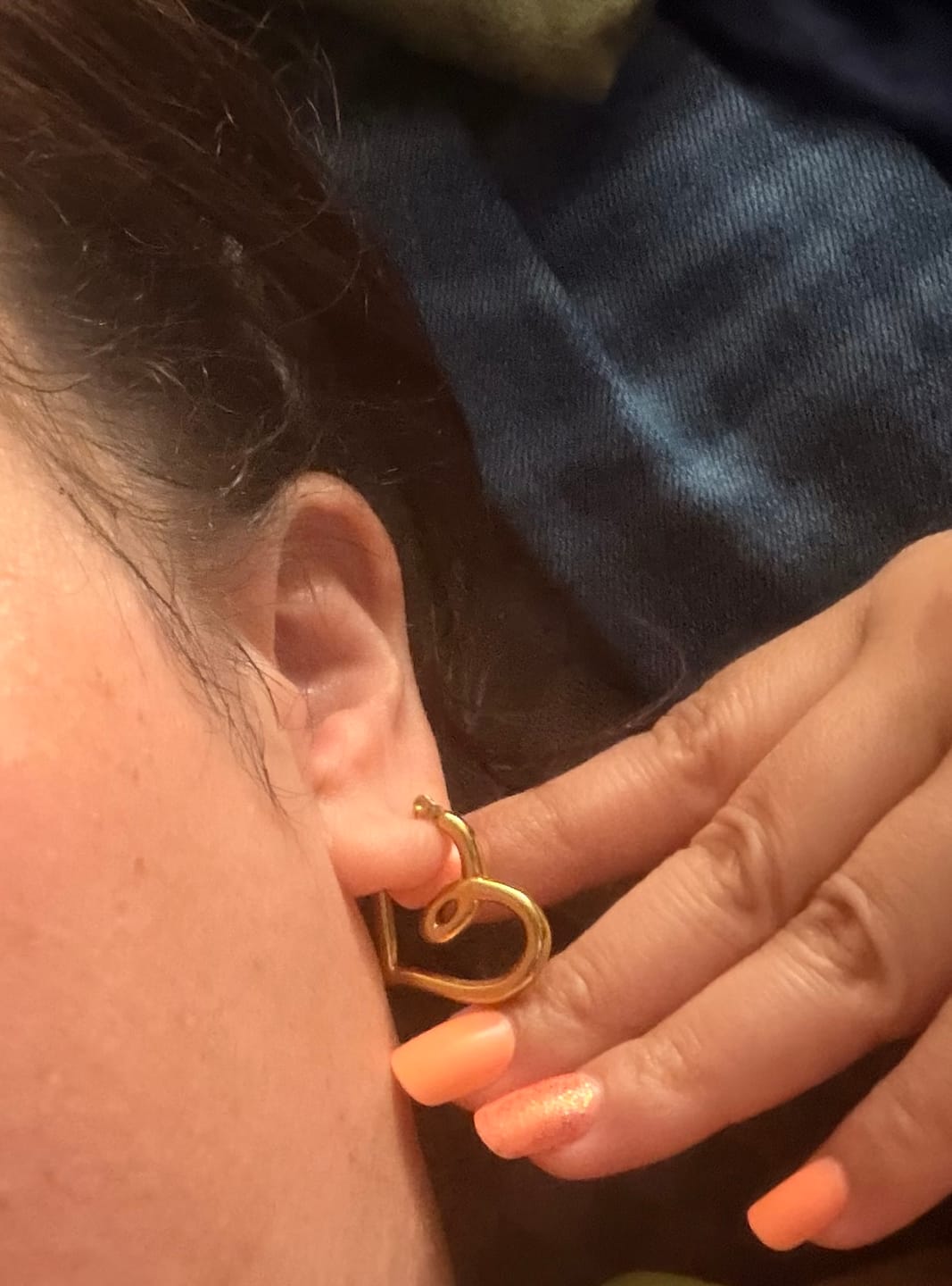 Customer photo review of Lira Twisted Heart Hoop Earrings