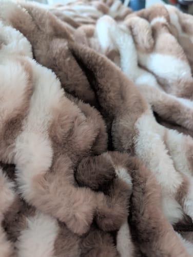 Reviewer's close-up of the soft, plush texture on the Hugs Swirl Hot Chocolate Blanket.