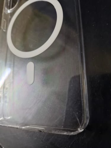 Close-up of the reviewer's Anti Yellow Magsafe Clear Case with a visible crack on the bottom corner.