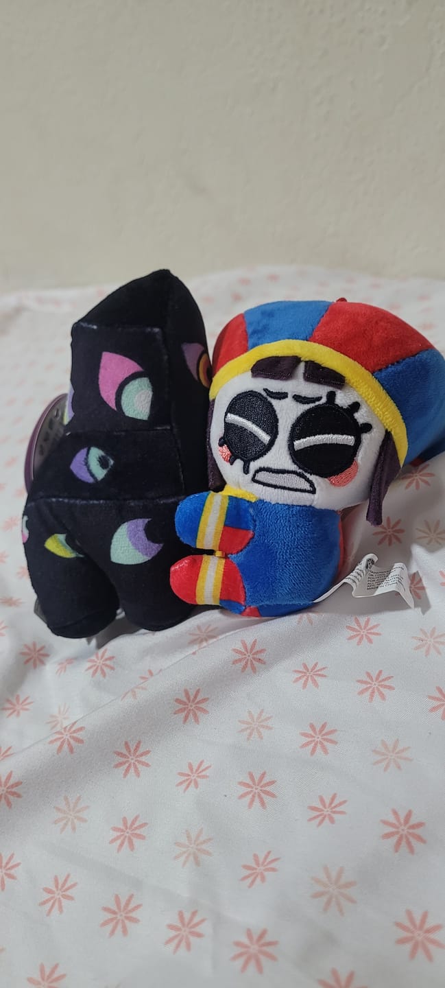 Customer photo review of Pomni & Abstraction Magnetic Plush Keychains