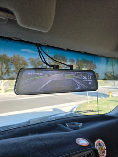 Customer's WOLFBOX Anti-Glare Film installed on a G900PRO Mirror Camera, showing a clear, glare-free display in a car.