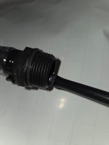 Customer's close-up image of the 5 Gallon Jug's hose, showing the black vent tube pinched where it connects to the spout.