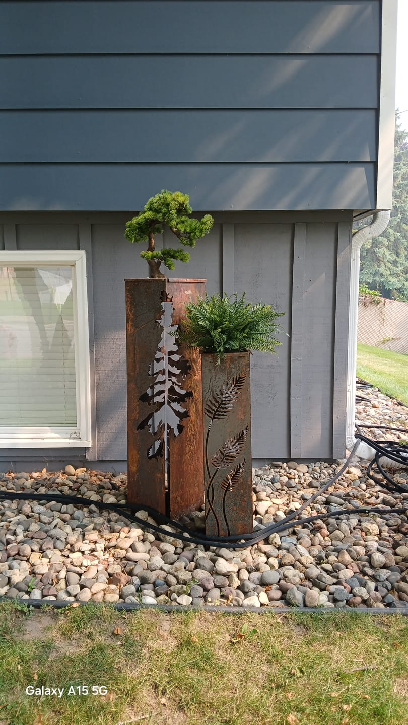 Customer photo review of Fern with Stem Garden Columns  – Metal Outdoor Sculpture & Well Cover – Rustic Steel Garden Decor