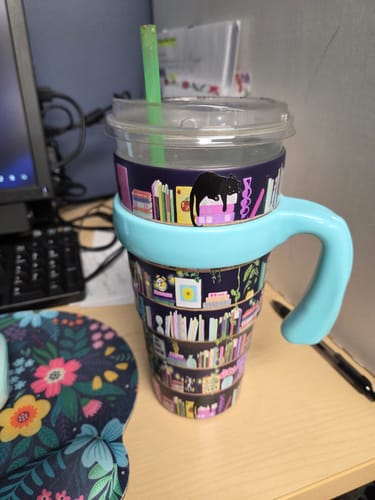 Customer's 'Shelf Life' Mystery Thicc Buddy with a light blue handle and bookshelf pattern on a desk.