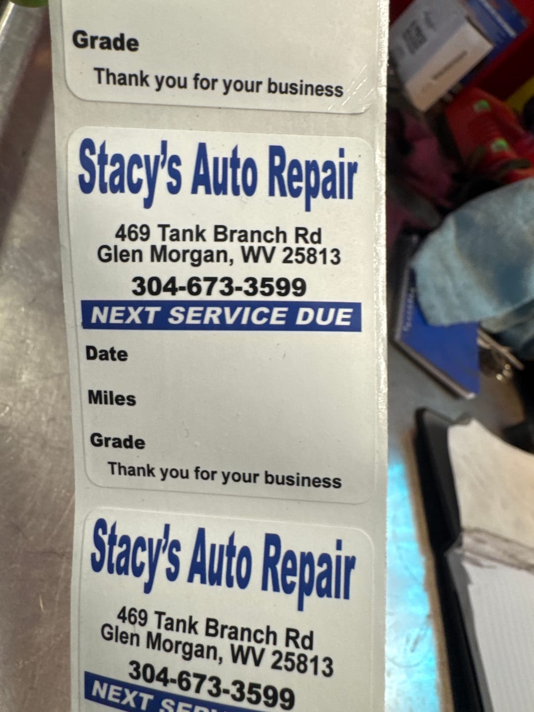 Customer photo review of Custom Oil Change Stickers for Windshield with Text