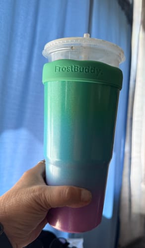 Customer holding their colorful Prism Pop To-Go Buddy with a drink cup inserted.