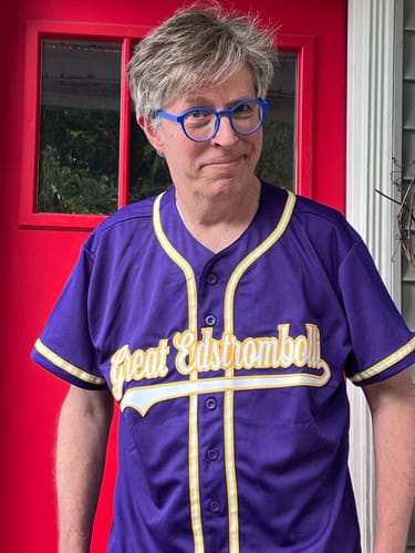 image 1 out of 2: Customer wearing a custom purple baseball jersey with 'Great Edstromboli' on the front.