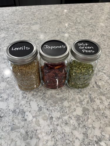 Customer's three glass jars with Chalkboard Top Mason Jar Lids, labeled "Lentils," "Japones," and "Split Green Peas."