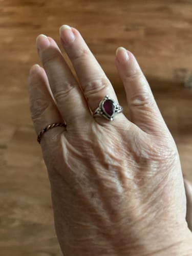 Customer showing the comfortable fit of the size 6 Ruby Teardrop Ring on their hand.