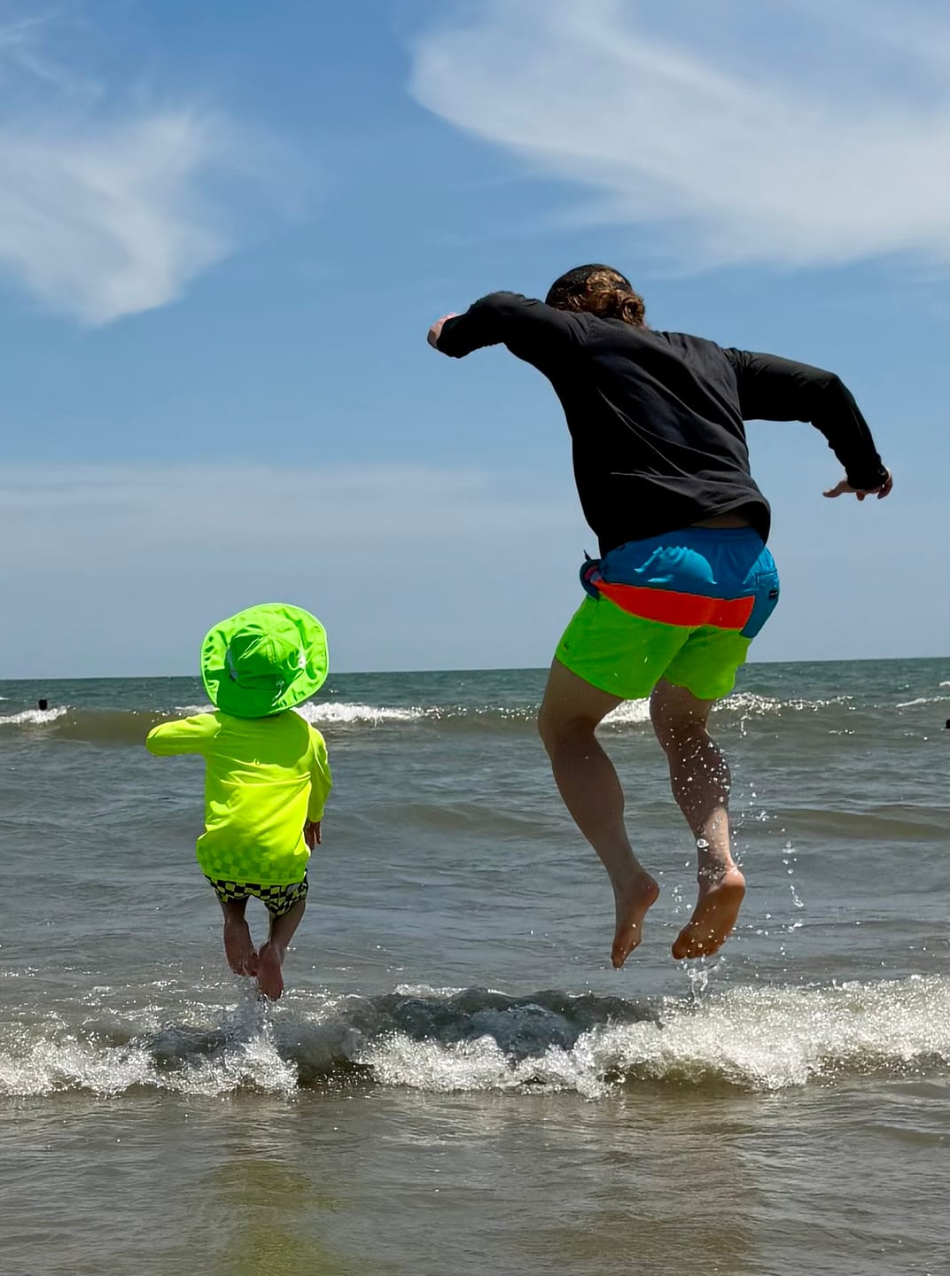 Customer photo review of Hybrid Swim Trunks in Neon Electric Lime + Black Checkered