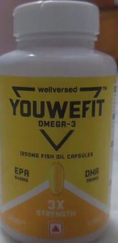 Customer's close-up of the YouWeFit Omega-3 Fish Oil bottle, showing the yellow label with '3X STRENGTH' text.