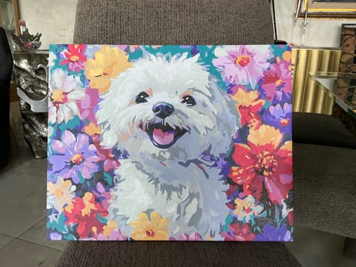 Customer's finished Bichon Frise paint by numbers canvas, showing a happy dog surrounded by colorful flowers.