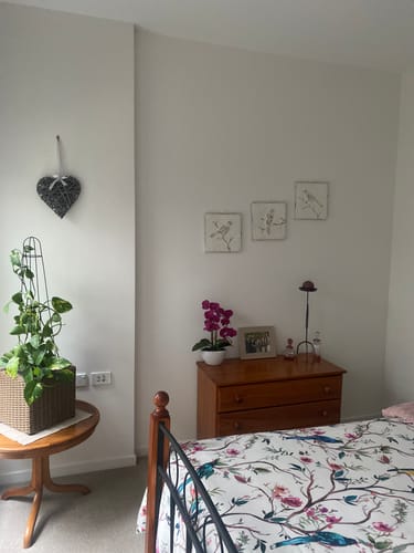 Customer's Imogen Metal Wall Art set hung in a staggered pattern on a bedroom wall above a wooden chest of drawers.