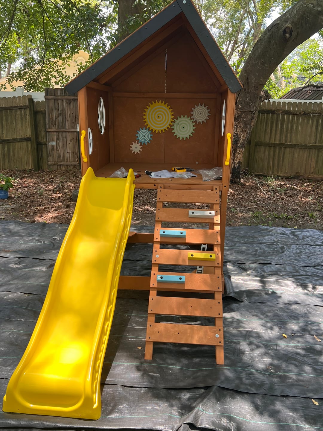 Customer photo review of Mimosa Wooden Outdoor Playhouse with Slide, Climbing Stairs & Sensory Gear Panel