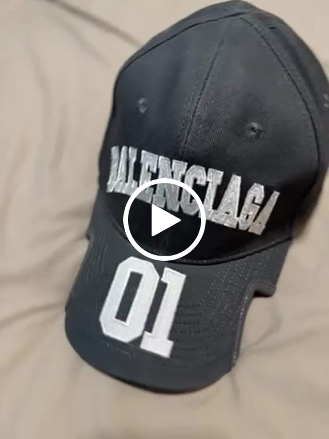 Customer video review of Charcoal cotton cap with varsity embroidery and sculpted brim