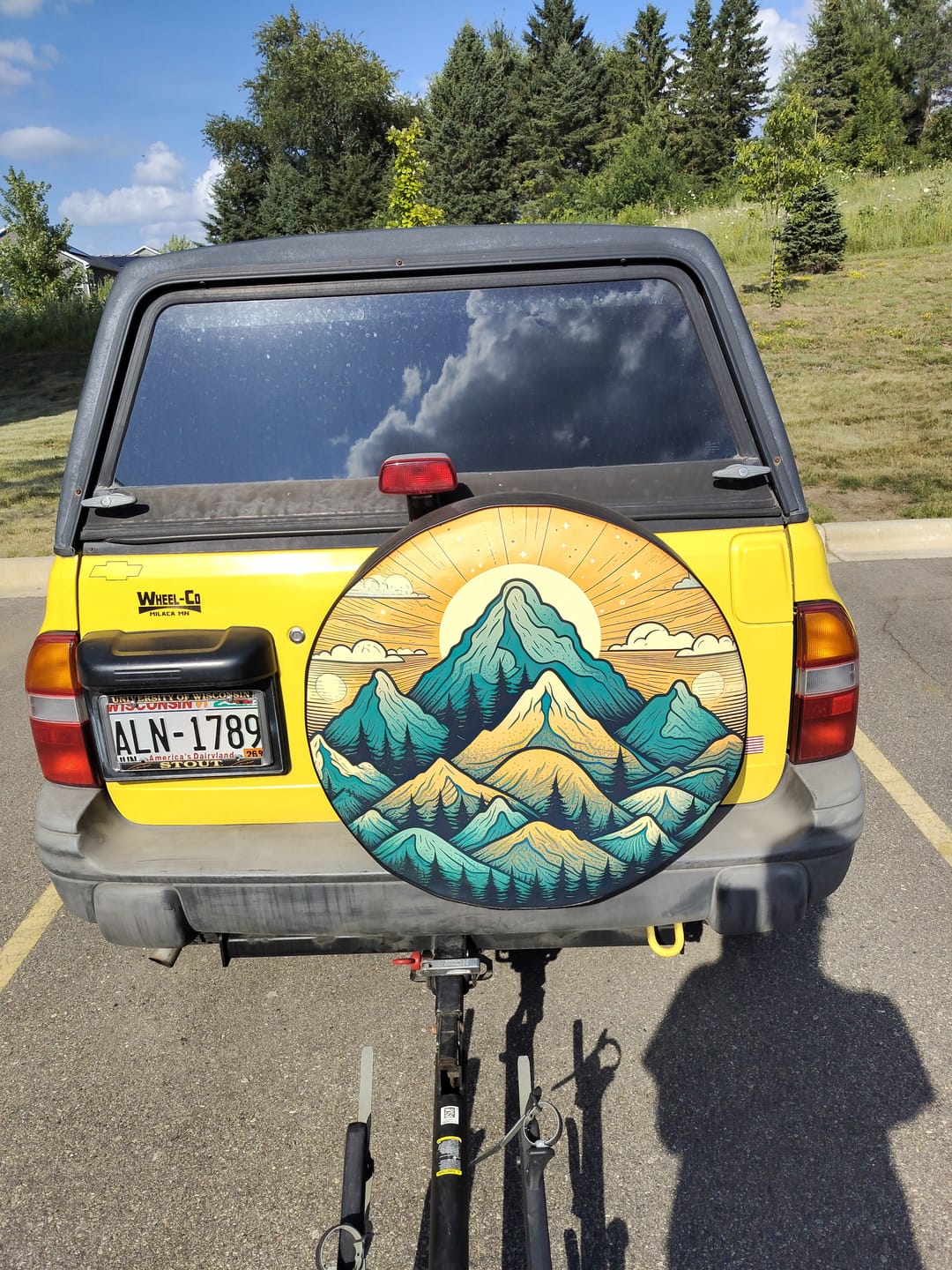 Customer photo review of Mountain Landscape Vibrant Orange & Teal Sunset Spare Tire Cover for Jeep, Bronco, RV, Camper, & More
