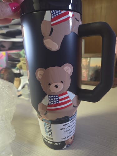 Customer's black Thicc Buddy 40oz Stars & Snuggles tumbler, showing the patriotic teddy bear pattern and large handle.