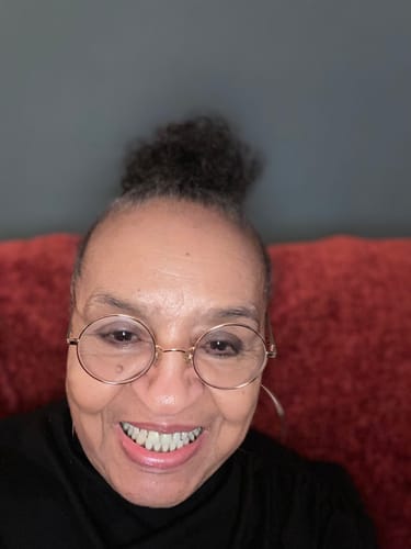 Reviewer smiling in a close-up selfie for their Royal Cherry Pre-Roll review.